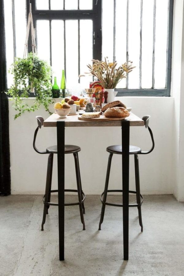 Genuine Nicolle metal chair measuring 30-inch in height, paired with a Tiptoe table. Perfect combination of style and durability from Chaises Nicolle.