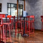 Nicolle metal chair, 80-cm height, red color, standing table with Livizza ECA Archi security in a restaurant