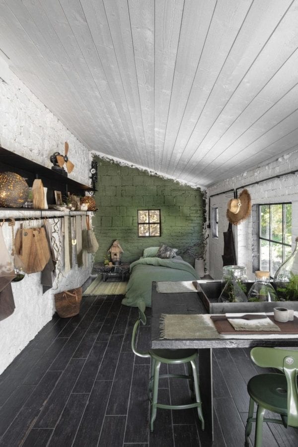 Metal chair by Chaises Nicolle, 60-cm in height. Green high table and chairs in a studio at Serge ANTON's house in Maison Ardennes.