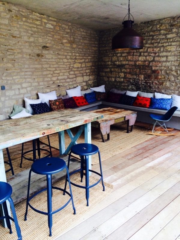 Metal Nicolle stool H24-inch - Industrial metal stool by Nicolle gathered around a high table in a house in Bourgogne.