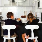 Children having breakfast on Chaises Nicolle high metal chair.