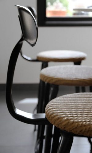 Mademoiselle Breizh chair with a seat height of 65-cm, crafted with a combination of loom and metal from Chaises Nicolle.