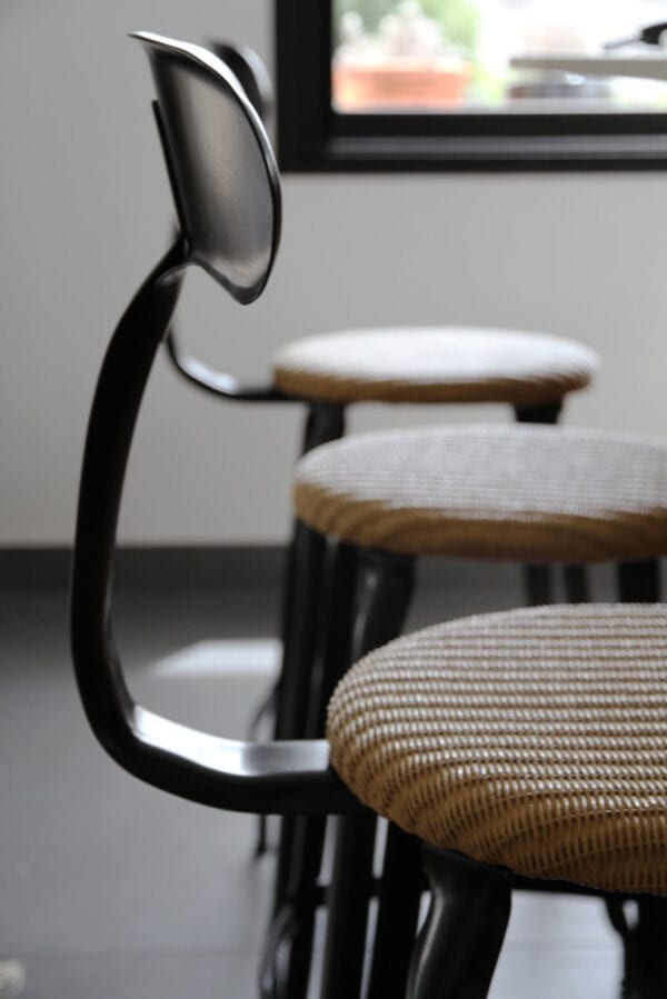 Mademoiselle Breizh chair with a seat height of 65-cm, crafted with a combination of loom and metal from Chaises Nicolle.