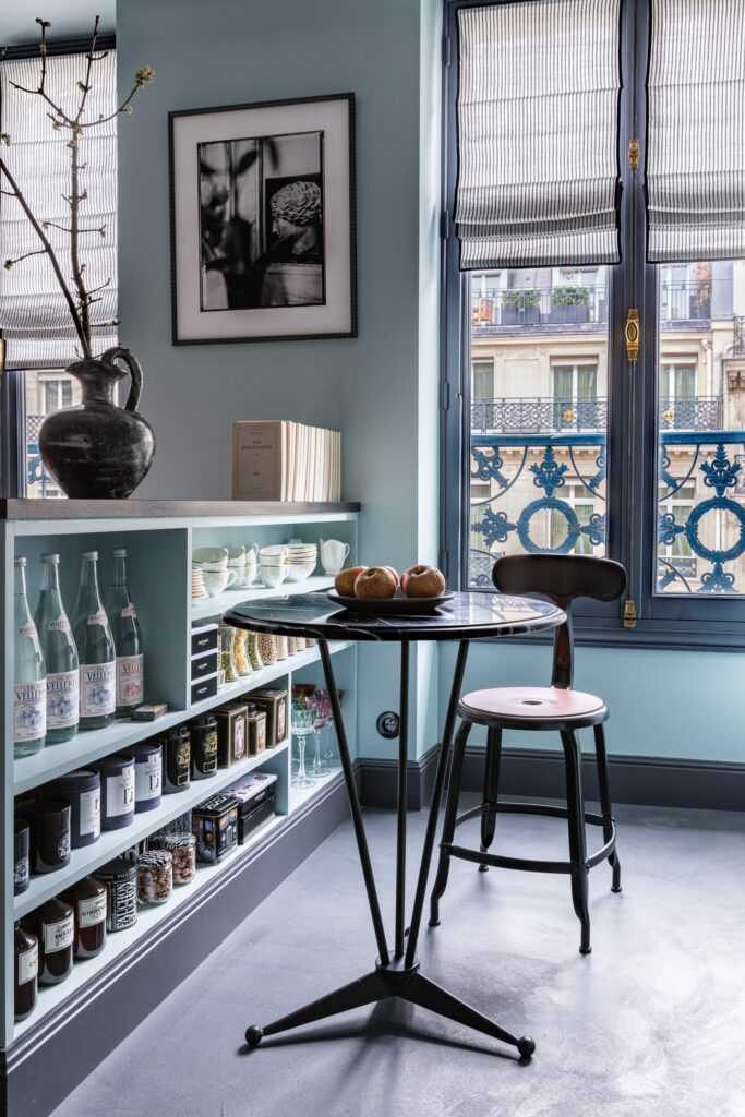 Small side table in a cozy Parisian pied-à-terre by Marianne Evennou