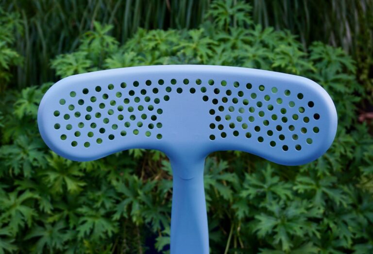 Outdoor chair by Chaises Nicolle, designed by Paola Navone, featuring a perforated whale tail pattern. Perfect for the Milan Fuori Salone exhibition.