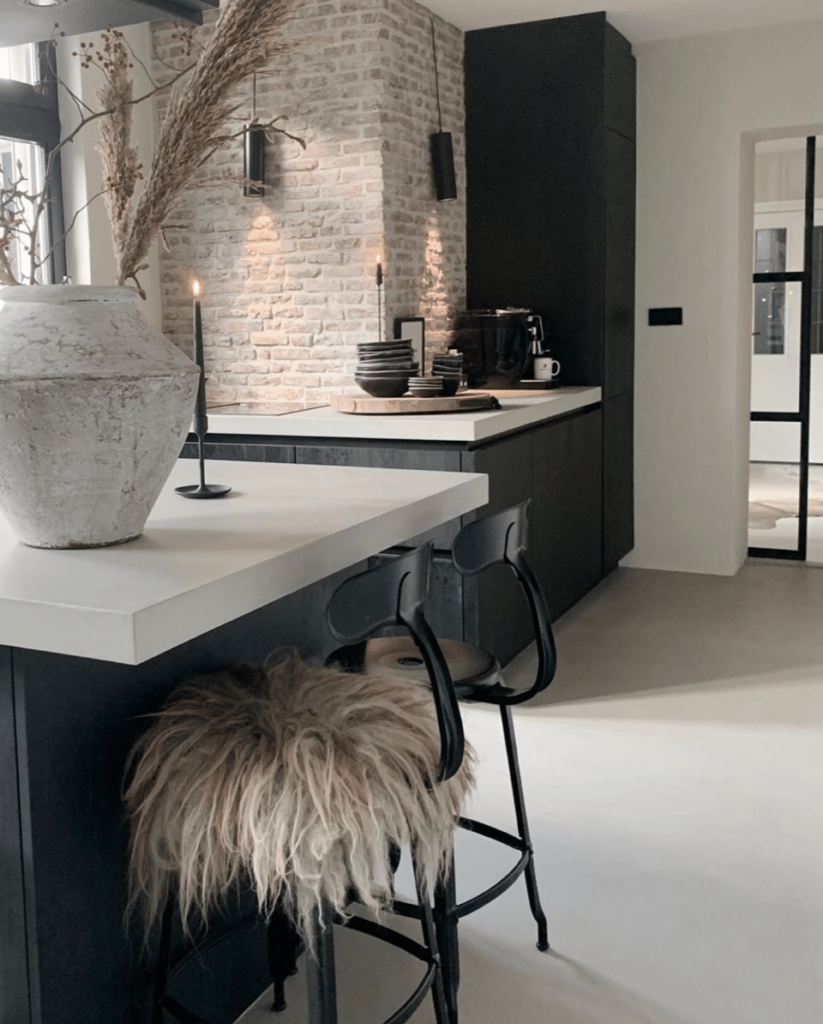 Metal Chaise Nicolle in front of a kitchen island