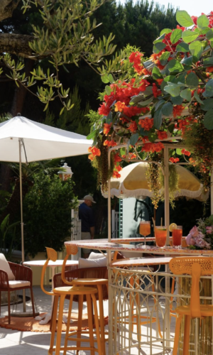 Outdoor metal chair from Chaises Nicolle, with a height of 75-cm, beautifully displayed on the terrace of Hotel Juana during a relaxing walk along the picturesque promenade.